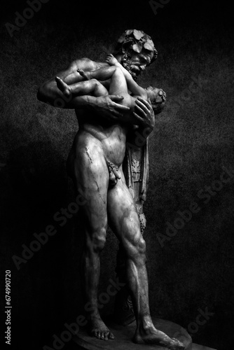 Vertical of Silenus and Dionysus sculpture in Vatican Museum in grayscale