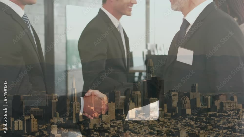 Composite video of two diverse businessmen shaking hands against aerial view of cityscape Composite video of two diverse businessmen shaking hands against aerial view of cityscape
