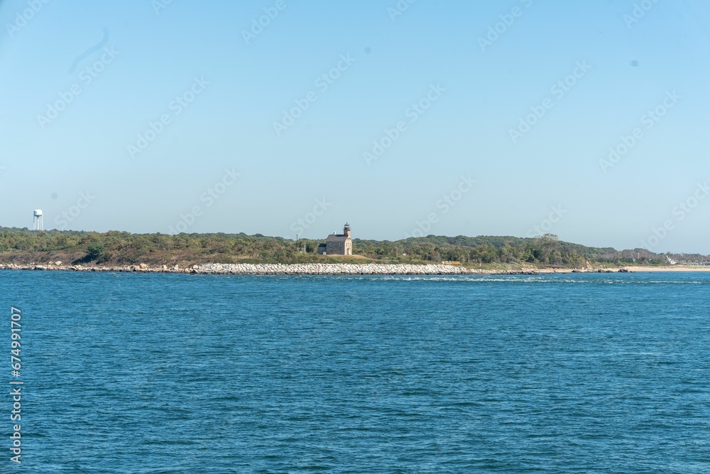Scenic view of a lighthouse on the beach on a sunny day