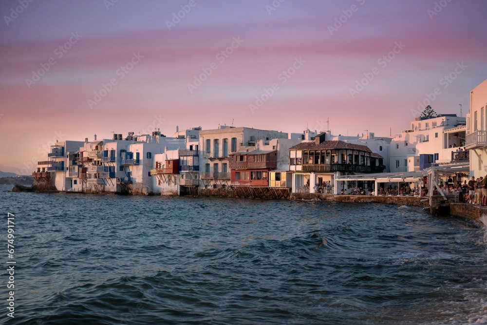 Mikonos Town is a picturesque location, with a spectacular view of the sun setting over the horizon