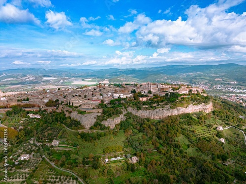 Aerial view of the Italian city of Orvieto, located on a lush green hillside