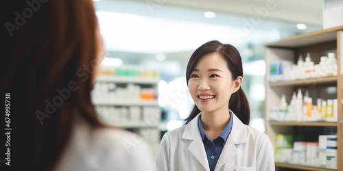 Professional Chinese pharmacist ensuring a customer's well-being with a smile.