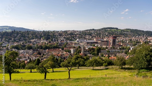 City of St Gallen surrounded by a lush green grassy field