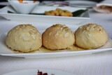 White Plate with four biscuits, closeup
