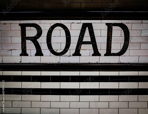 White and black sign with the text 