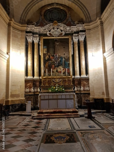 an empty church with many ornate decors and windows on the sides