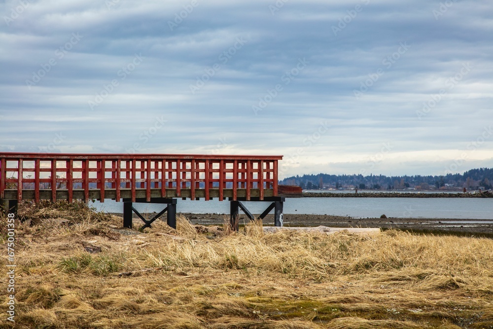 Vibrant red wooden pier at Royston Shoreline Park, Royston BC Vibrant red wooden pier at Royston Shoreline Park, Royston BC