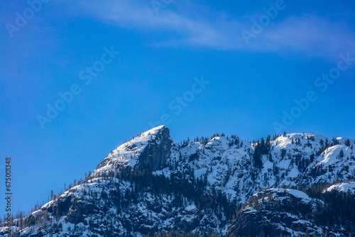 Wintery mountain peak covered in snow © Wirestock