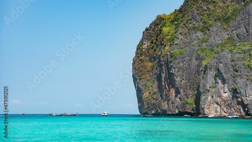 Ccenic view of pure blue sea, boats and distant mountains, Phuket and Phi Phi Island, Thailand © Wirestock