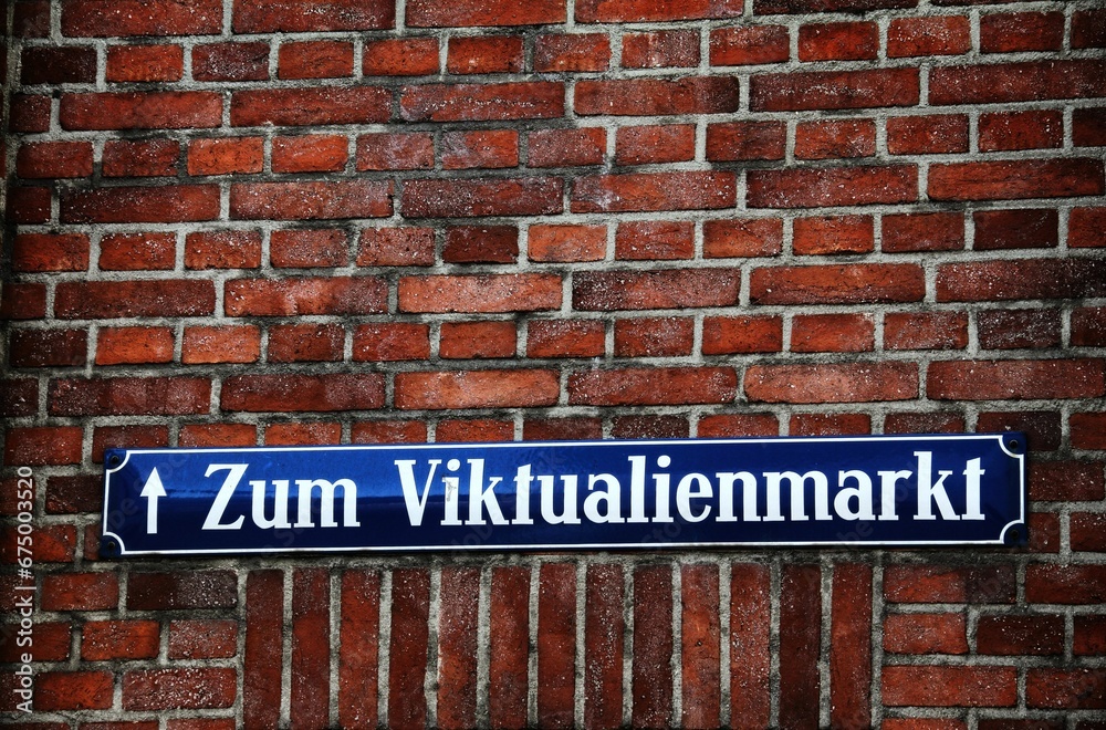 Obraz premium Street Sign on bricks wall to the Viktualienmarkt in Munich