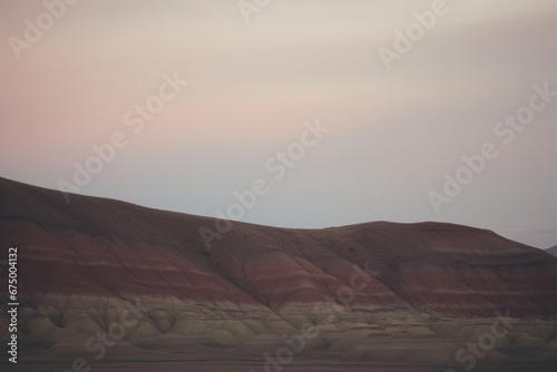 Dusk over the Painted Hills  horizon in earthy tones.