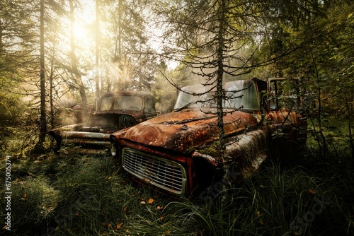 Car graveyard, carcemetery, Old abandoned cars in sunrise and fog, located in Trondheim, Norway