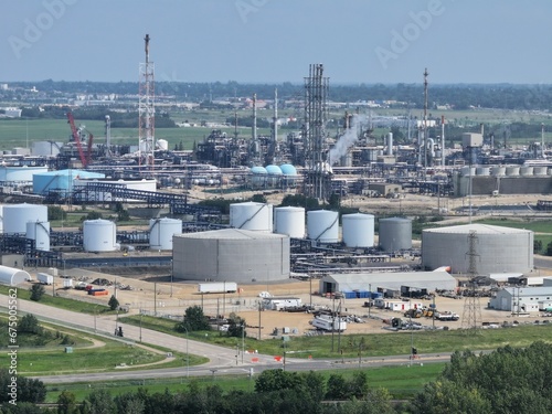 an industrial area with many tanks and equipment around it taken in spring