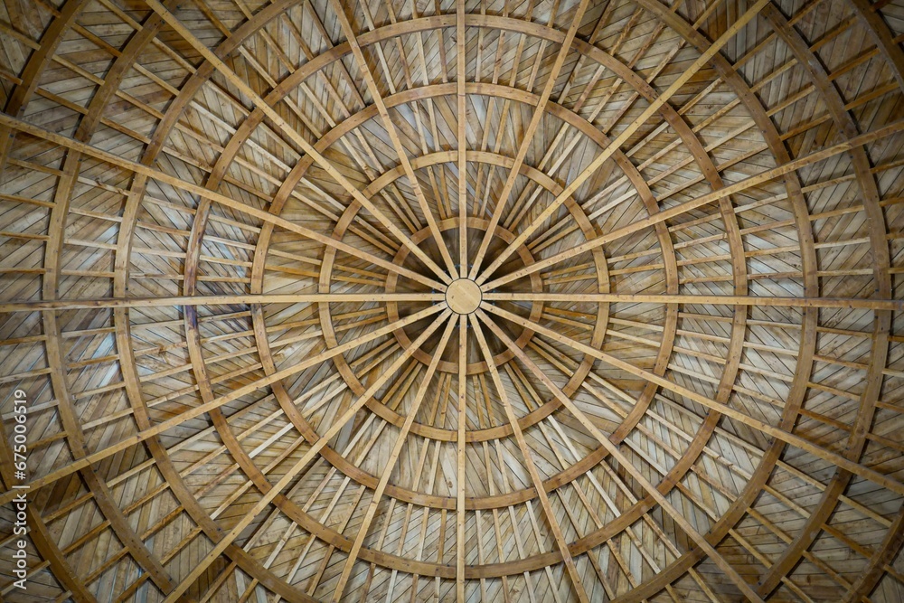 there is a bamboo roof with lots of straws inside