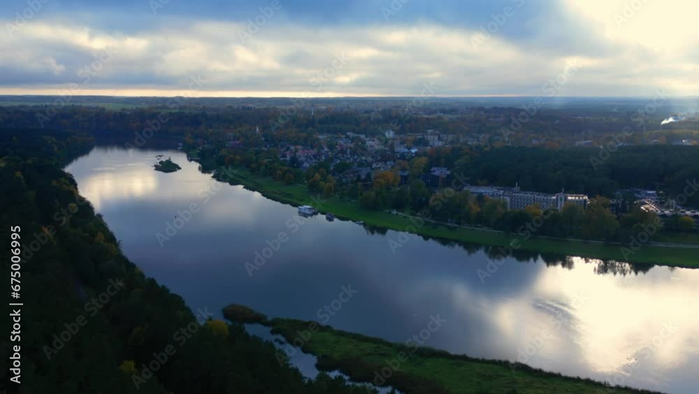 Aerial zoom in at Birstonas village next to Memis river at sunet with clouds Aerial zoom in at Birstonas village next to Memis river at sunet with clouds