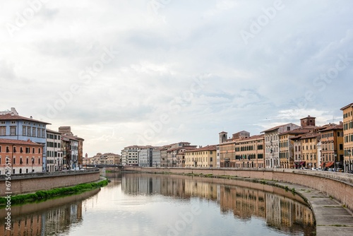 Medieval town of Pisa from bridge "Ponte di Mezzo" on river
