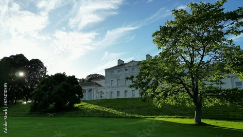 Drone showing the Kenwood House behind trees with blue sky in London, England photo