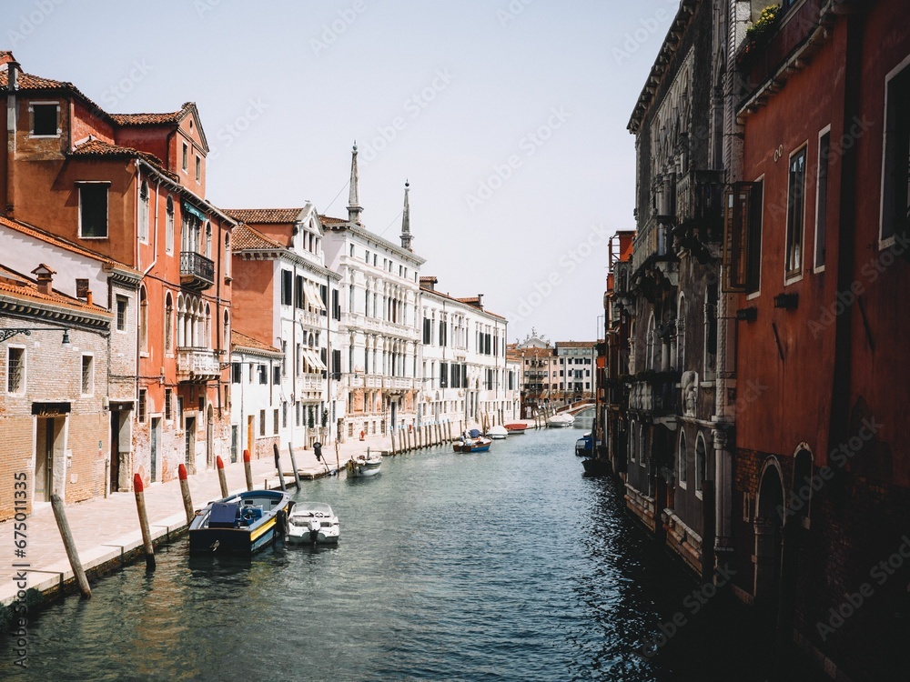 Scenic view of gondolas sailing in a canal of Venice, Italy