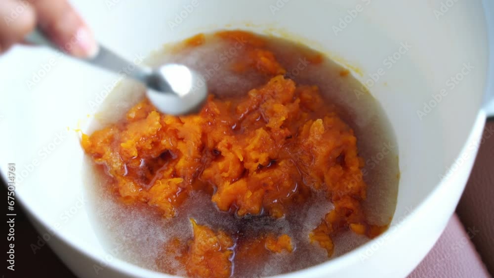 Adding ingredients to pumpkin puree roast in bowl preparing ingredients for pumpkin muffins Adding ingredients to pumpkin puree roast in bowl preparing ingredients for pumpkin muffins