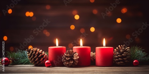 christmas decoration background  red lighted candles with pine cones and xmas ornament on wooden table on shiny warm celebration background  with copy space.