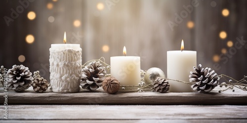 White Christmas candles on rustic wooden table  with natural decorations of pine branches and cones  Greeting cards backgrounds with copy space  Merry Christmas and Happy New Year.