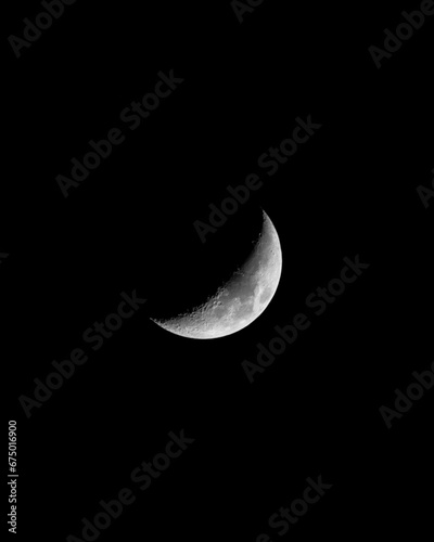 Stunning crescent moon illuminating the night sky against a dark backdrop