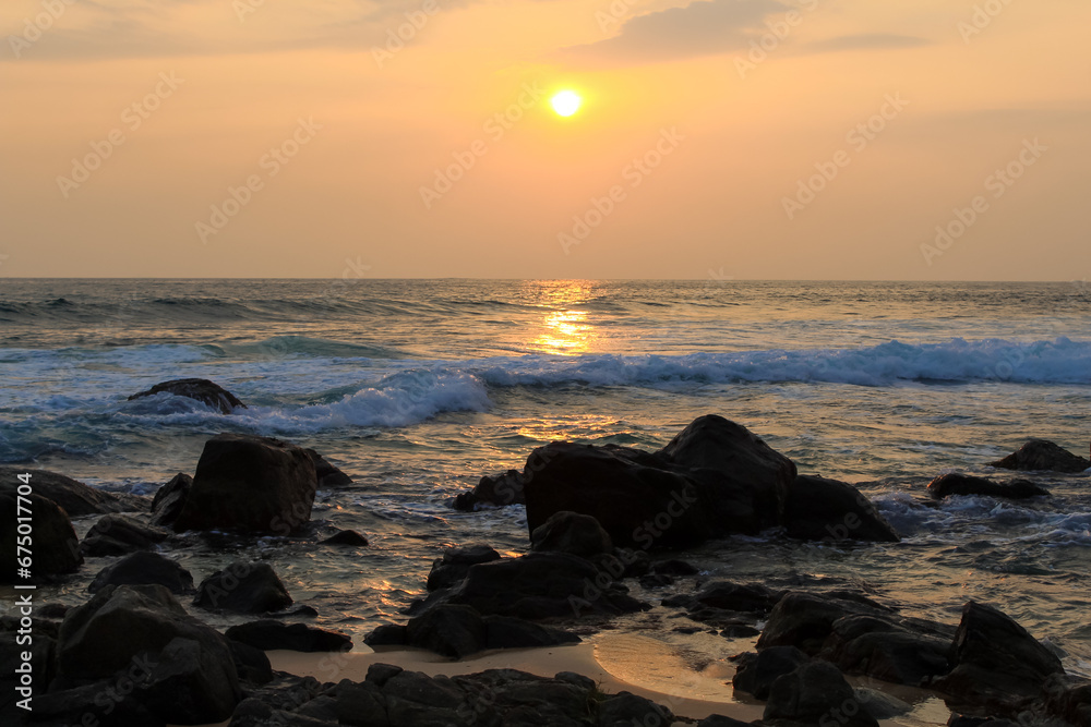 Unawatuna beach in Sri Lanka. Waves crashing on the rocks