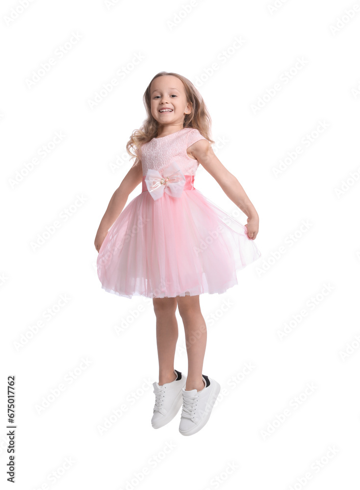 Cute little dancer in beautiful dress jumping on white background