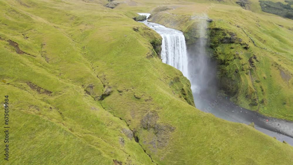 Experience Skógafoss Waterfall from above with our 4K drone footage, highlighting Iceland's epic scenery. Ideal for nature films and travel showcases. The shit reveals the amazing waterfall. Experience Skógafoss Waterfall from above with our 4K drone footage, highlighting Iceland's epic scenery. Ideal for nature films and travel showcases. The shit reveals the amazing waterfall.
