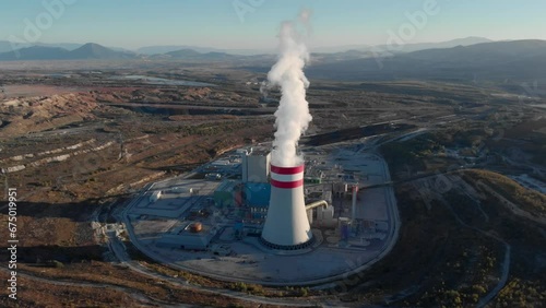 Orbit Drone Smoke steam tracking  chimney coal fired power station plant sunset photo