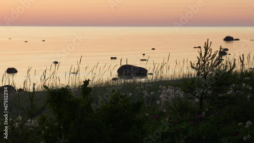 Relaxing waves in sunset by the sea photo