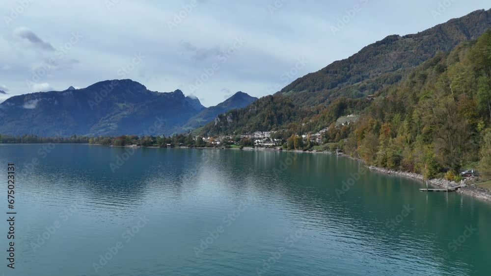 Aerial flyover lake walen during cloudy day in swiss mountains - Approaching shot - weesen, switzerland Aerial flyover lake walen during cloudy day in swiss mountains - Approaching shot - weesen, switzerland