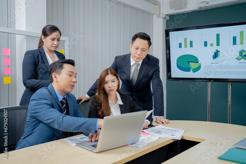 Office Conference Business Meeting Presentation: asian Business people group meeting Talks, Uses Wall TV to Show Company Growth with Big Data Analysis, Graphs, Charts, Infographics, e-Commerce Startup