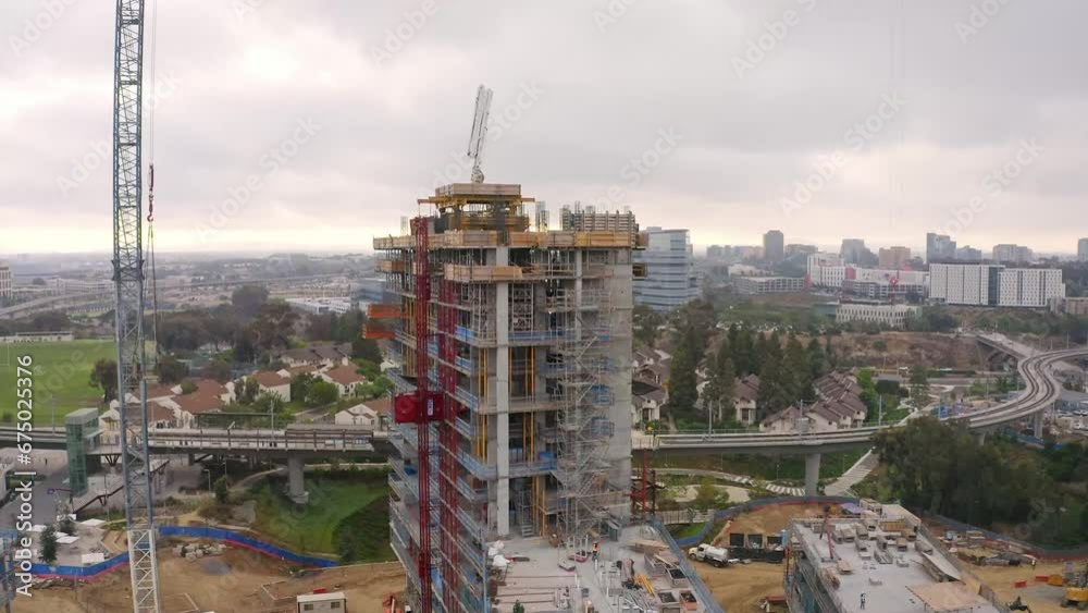 Wide drone shot of a high rise construction site in La Jolla, California. Wide drone shot of a high rise construction site in La Jolla, California.