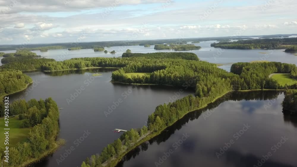 Drone view over forested islands surrounded by lakes Drone view over forested islands surrounded by lakes