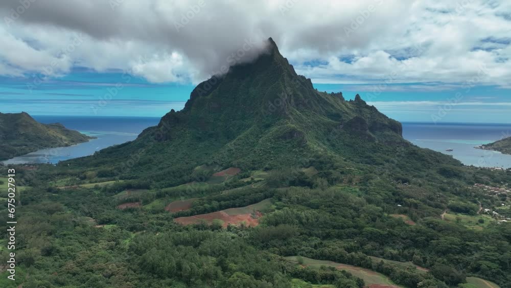 Majestic Peak Of Mount Rotui In The Island of Moorea, French Polynesia. Aerial Pullback Majestic Peak Of Mount Rotui In The Island of Moorea, French Polynesia. Aerial Pullback