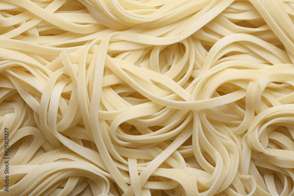 The close up detail of fresh cooked homemade strand pasta spaghetti texture as a background and wallpaper. Generative AI. The close up detail of fresh cooked homemade strand pasta spaghetti texture as a background and wallpaper. Generative AI.