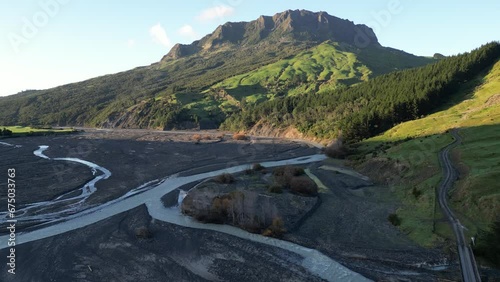 Drone dolly push in to Mt Hikurangi, braided rivers across floadplains below photo