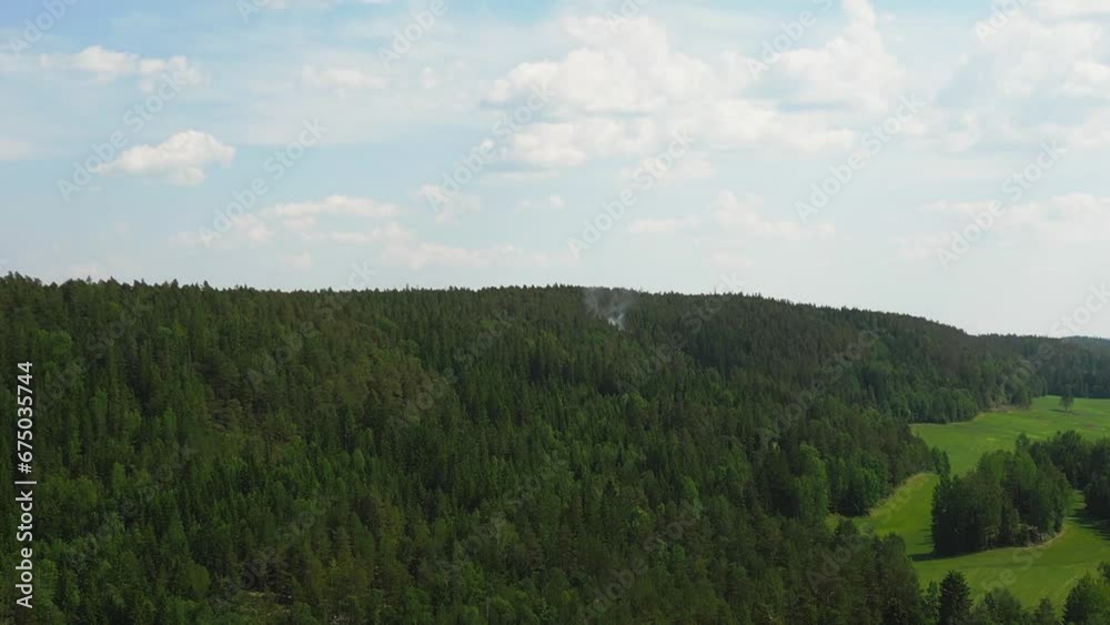 Drone view over forested green mountains during daytime Drone view over forested green mountains during daytime