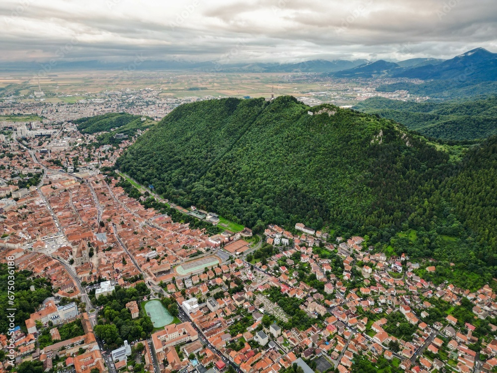Aerial view of a city landscape featuring buildings, trees, and streets in Nicolae Titulescu Park