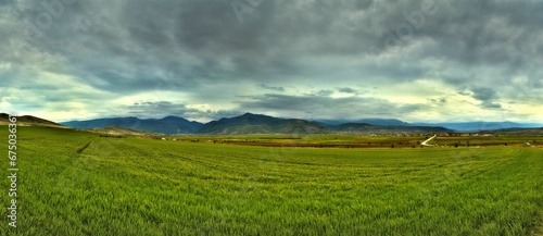 Scenic countryside landscape amongst rolling hills and lush green fields