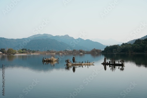 Tranquil scene featuring a small boat resting atop a lake in Shunhe Town in Tengchong City  China