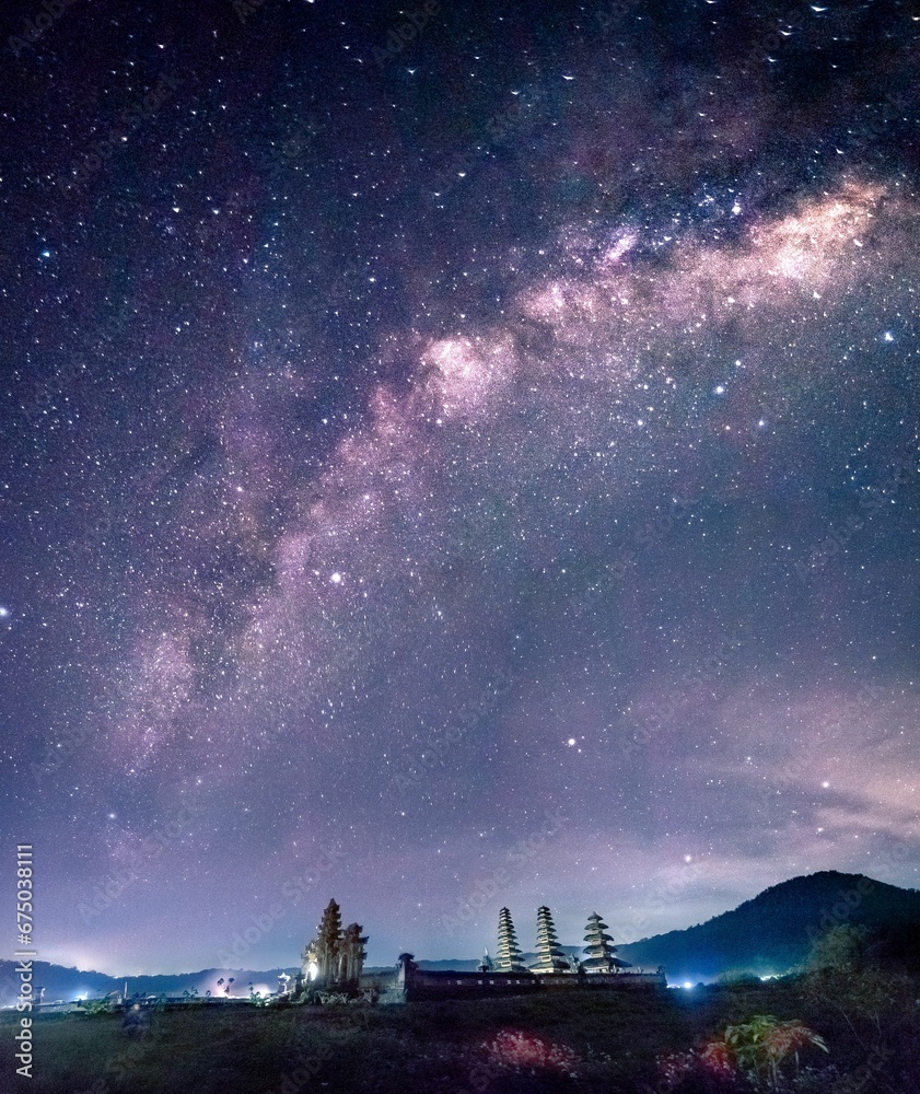 AI generated illustration of the Tamblingan Lake Temple in Munduk, Bali, under the starry night sky