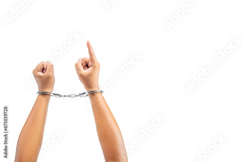 Human hand in handcuff with a hand gesture of pointing something