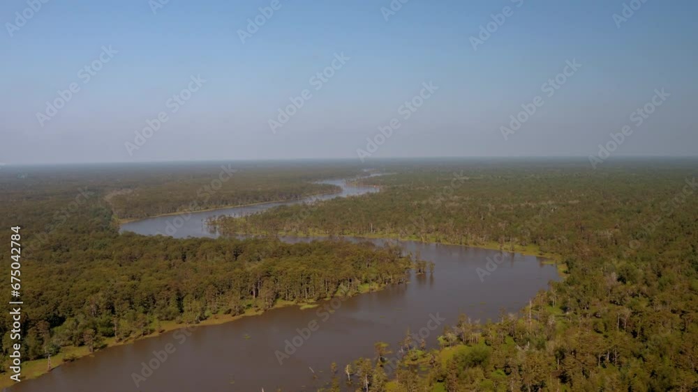 Aerial Shot Of Atchafalaya River Amidst Trees In Forest, Drone Flying Forward On Sunny Day - Bayou, Louisiana Aerial Shot Of Atchafalaya River Amidst Trees In Forest, Drone Flying Forward On Sunny Day - Bayou, Louisiana