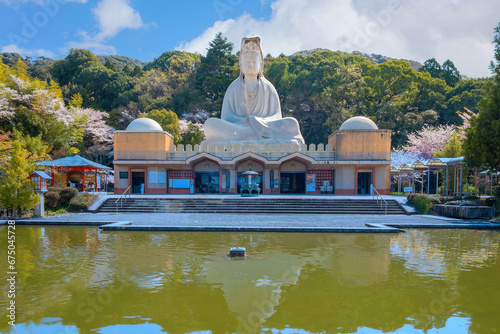 Kyoto, Japan - March 30 2023: Ryozen Kannon Temple is a war memorial dedicated to the fallen both sides of the Pacific War.The 24-meter statue of the Goddess of Mercy was built in 1955 photo