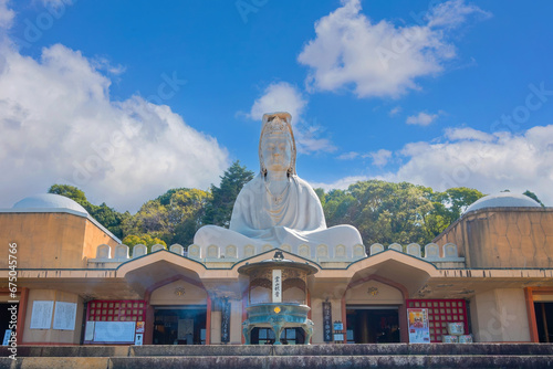 Kyoto, Japan - March 30 2023: Ryozen Kannon Temple is a war memorial dedicated to the fallen both sides of the Pacific War.The 24-meter statue of the Goddess of Mercy was built in 1955 photo
