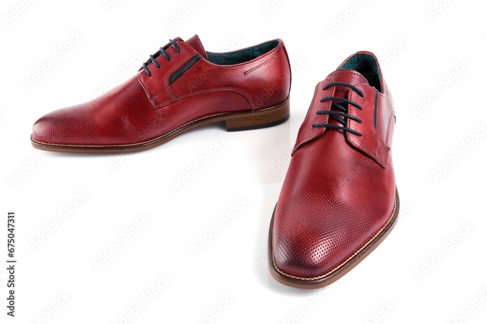 Male red leather shoes on white background, isolated product.
