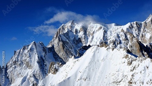 Aerial view of the majestic Monte Bianco mountain range, featuring a stunning winter landscape
