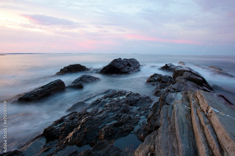Beautiful view of a shoreline with rock formations and crashing sea waves